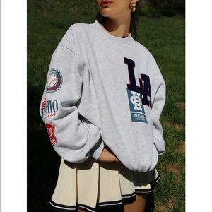 medium grey urban outfitters crewneck with sewed on patches. came that way.